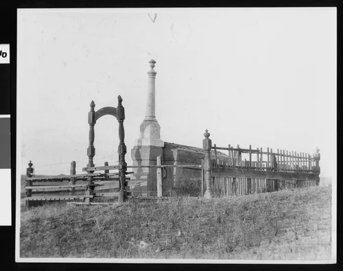 View of the Louis Wolf Monument, possibly a burial vault, on a know overlooking Temecula Valley, ca.1900
