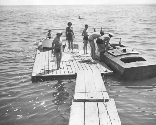 People on a floating dock in the Salton Sea, Date Palm Beach, ca.1940