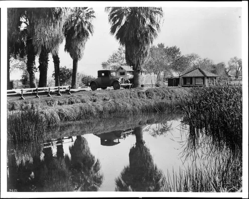 View of the pond and area around an Indian-owned bath house in Palm Springs, ca.1934