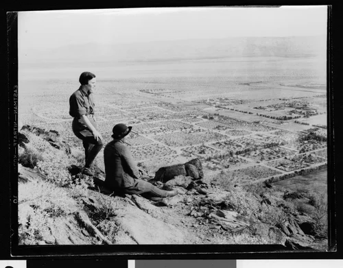 Two women on a mountainside overlooking the Coachella Valley, ca.1930