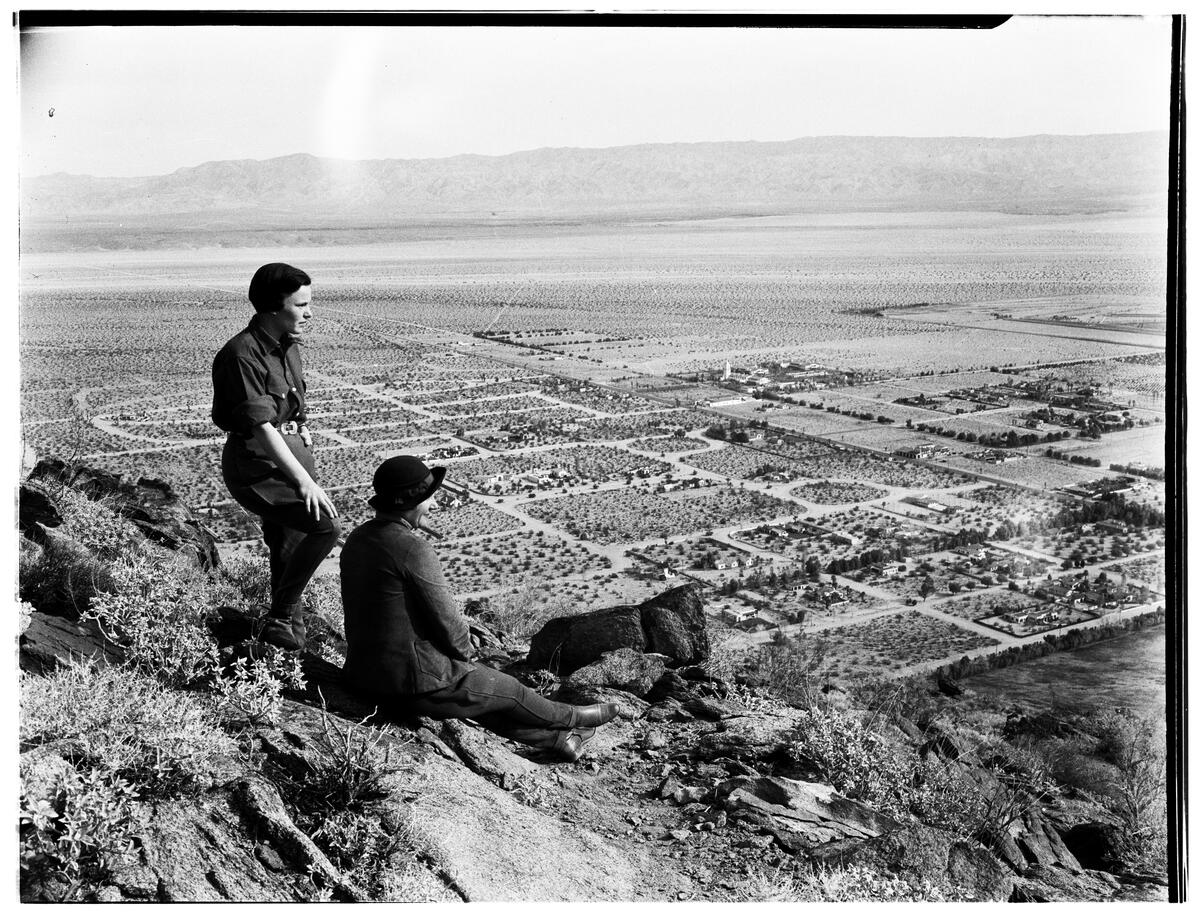Two women on a mountainside overlooking the Coachella Valley, ca.1930