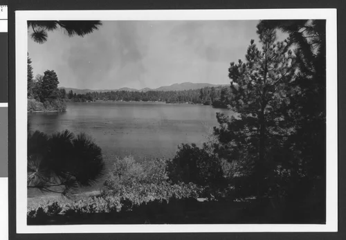 View of Lake Arrowhead through trees, ca.1950