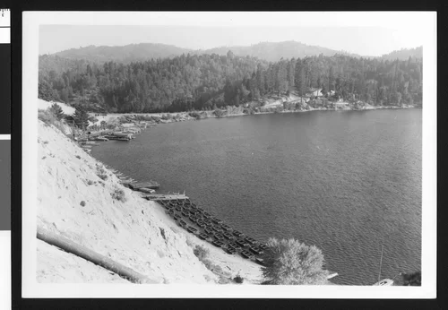 Boats lined up near the banks of Lake Arrowhead, ca.1950