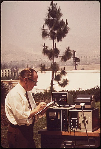 AT THE STATEWIDE AIR POLLUTION RESEARCH CENTER, UNIVERSITY OF CALIFORNIA AT RIVERSIDE, SCIENTIST WORKS WITH MACHINE FOR THE DETECTION OF SULFUR COMPOUNDS IN THE AIR