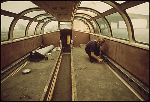 INTERIOR OF AN AMTRAK DOME PASSENGER CAR HAS BEEN STRIPPED AT A PLANT IN MIRA LOMA, CALIFORNIA, NEAR RIVERSIDE. IT IS ONE OF SEVERAL PLACES IN THE UNITED STATES WHERE AMTRAK CARS ARE MECHANICALLY OVERHAULED, REPAINTED INSIDE AND OUT, CARPETED AND REFURBISHED ON THE INSIDE