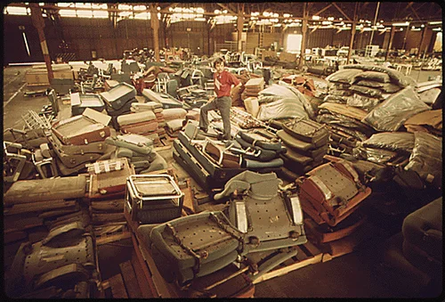 OLD EQUIPMENT FROM AMTRAK PASSENGER CARS IS PILED IN A WAREHOUSE. SOME OF IT WILL BE RENOVATED, THE REMAINDER WILL BE DISCARDED AND REPLACED WITH NEW EQUIPMENT. OLD AMTRAK CARS PURCHASED FROM OTHER RAILROADS ARE OVERHAULED MECHANICALLY AND GIVEN NEW PAINT INSIDE AND OUT. AT MIRA LOMA