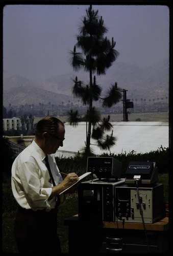 EDGARD STEPHENS, PROFESSOR OF ENVIRONMENTAL SCIENCE AT THE STATEWIDE AIR POLLUTION RESEARCH CENTER, USING OPTICAL PARTICLE COUNTER