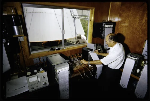RESEARCH ASSOCIATE, ERV MATEER, IN MONITORING STATION RECORDING RESULTS OF BURNING TOWER FIRE