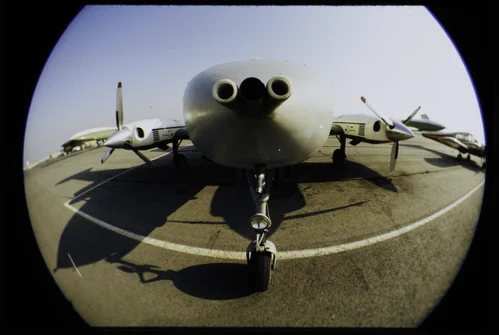 PLANE (SUPPLIED BY NASA) USES SPACE TECHNIQUES IN SMOG RESEARCH. SCIENTISTS FROM STATEWIDE AIR POLLUTION RESEARCH CENTER TAKE HYDROCARBON SAMPLES THROUGH TUBES PROJECTING FROM NOSE OF AIRPLANE