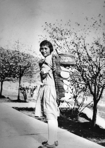 American Indian woman with baby in cradleboard